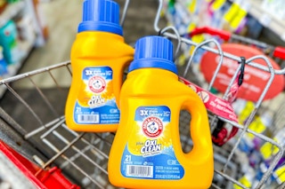 2 arm and hammer laundry detergents in a cart