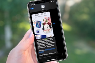 hand holding a phone with a text message from walgreens