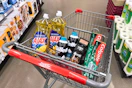ajax dish soap, gillette foamy shave cream, maybelline eyeshadow, axe deodorant, and colgate toothpaste in a cart