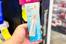 person holding a neutrogena lip sleeping mask