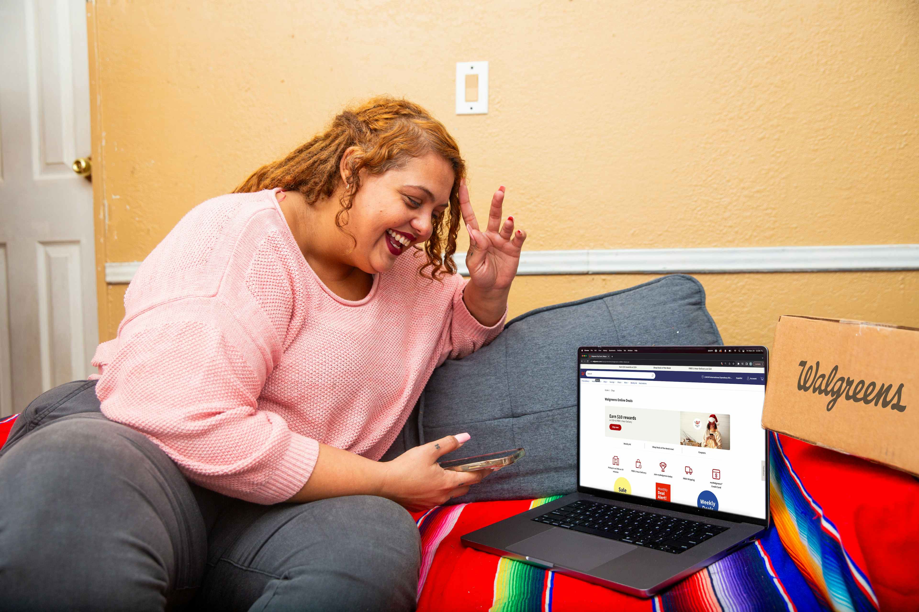 Person looking at a laptop showing the walgreens website 
