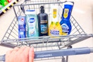 crest, dial, tresemme, mr clean, and dawn products in a cart