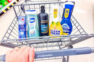 crest, dial, tresemme, mr clean, and dawn products in a cart