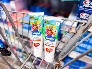 2 Orajel Mario toothpaste tubes in Walmart shopping cart