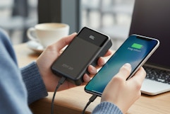 someone using a portable powerbank