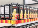 boxes of Truly popsicles on an aisle in the store with one box turned diagonally toward the camera