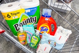 bounty paper towels, tide detergent, skintimate razors, huggies wipes, and softsoap hand soap in a cart