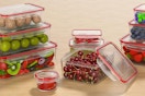 AdanZst 44-Piece Reusable Food Storage Container Set being used on a kitchen counter for food.