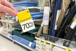 hand holding a 70% off clearance tag in home & garden at target