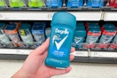 a hand holding a stick of deodorant