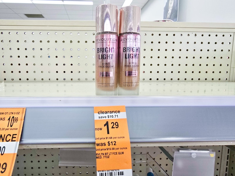 bottles of foundation by a $1.29 clearance sign