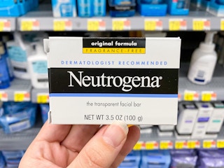 hand holding neutrogena facial cleansing bar at walmart