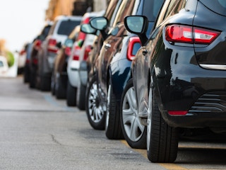 Cars parked along the street in a city