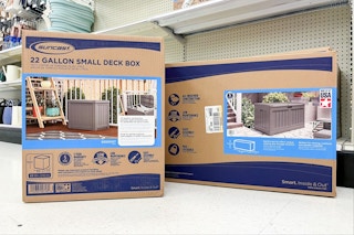 suncast deck boxes sitting on the floor in front of a target shelf