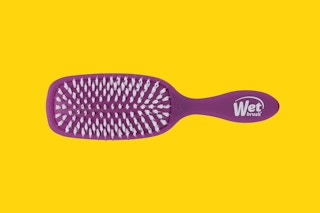 a wet brush on a yellow background