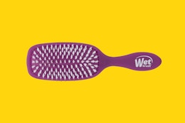 a wet brush on a yellow background