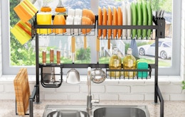 a rack of dishes over a kitchen sink