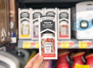 walmart poo pourri toilet spray hand holding