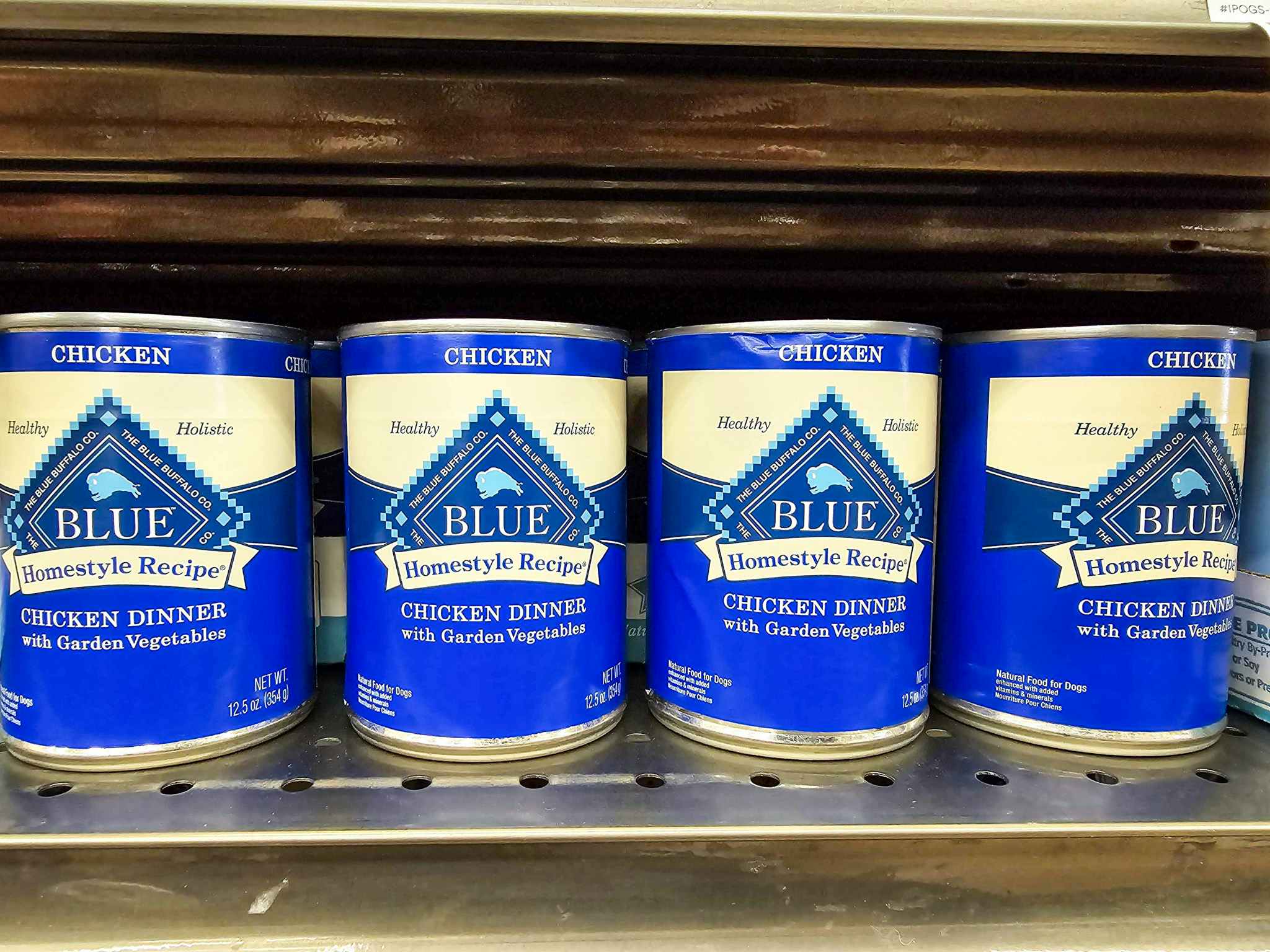 cans of blue buffalo dog food on a shelf