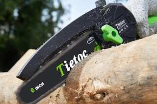 a mini chainsaw cutting wood