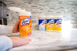 four canisters of Lysol wipes