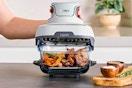 Lifestyle image of the Ninja Crispi 3-in-1 Portable Glass Air Fryer Cooking System being used in a kitchen setting