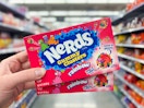 Nerds Gummy Clusters held up in center aisle in Walmart store