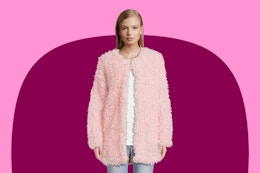 Model wearing a pink No Boundaries Juniors Faux Fur Jacket