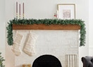 a Christmas garland on a mantle in a room