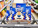 shopping cart with three boxes of frosted flakes cereal