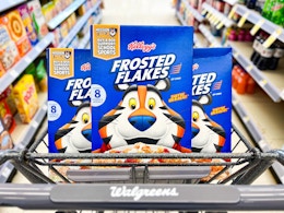 shopping cart with three boxes of frosted flakes cereal