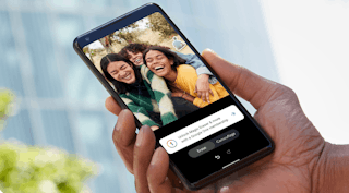 hand holding a phone with Google images displayed