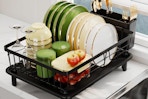 a dish drainer rack on a counter