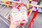 hand holding two garnier micellar waters