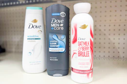 3 bottles of dove body wash on a shelf