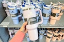 hand holding Stanly cup at Dick's on shelf