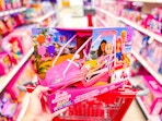 hand holding barbie beach buggy in target aisle