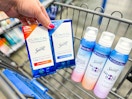hand holding two boxes of secret clinical deodorant with three whole body sprays in walmart cart