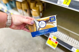 hand holding a glade candle twin pack