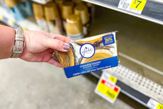 hand holding a glade candle twin pack