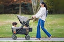 Lifestyle image of mom pushing Summer Infant Wagon with two small children inside outdoors