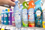 person grabbing febreze air freshener from a shelf