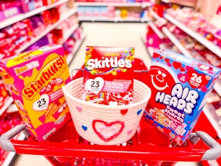 valentine's exchange candy packs sitting on top a target cart