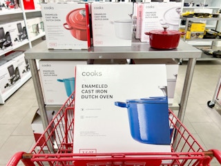 cooks dutch oven in its box in a shopping cart