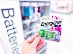 Energizer Batteries held in front of signage in Target store
