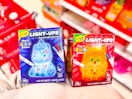 hand holding 2 crayola light-ups craft kits at target