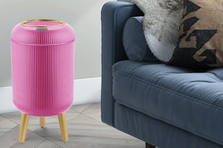 a smart wastebasket near a couch