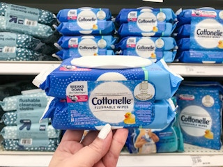 hand holding a pack of cottonelle wipes at target
