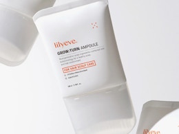 a person applying hair growth serum