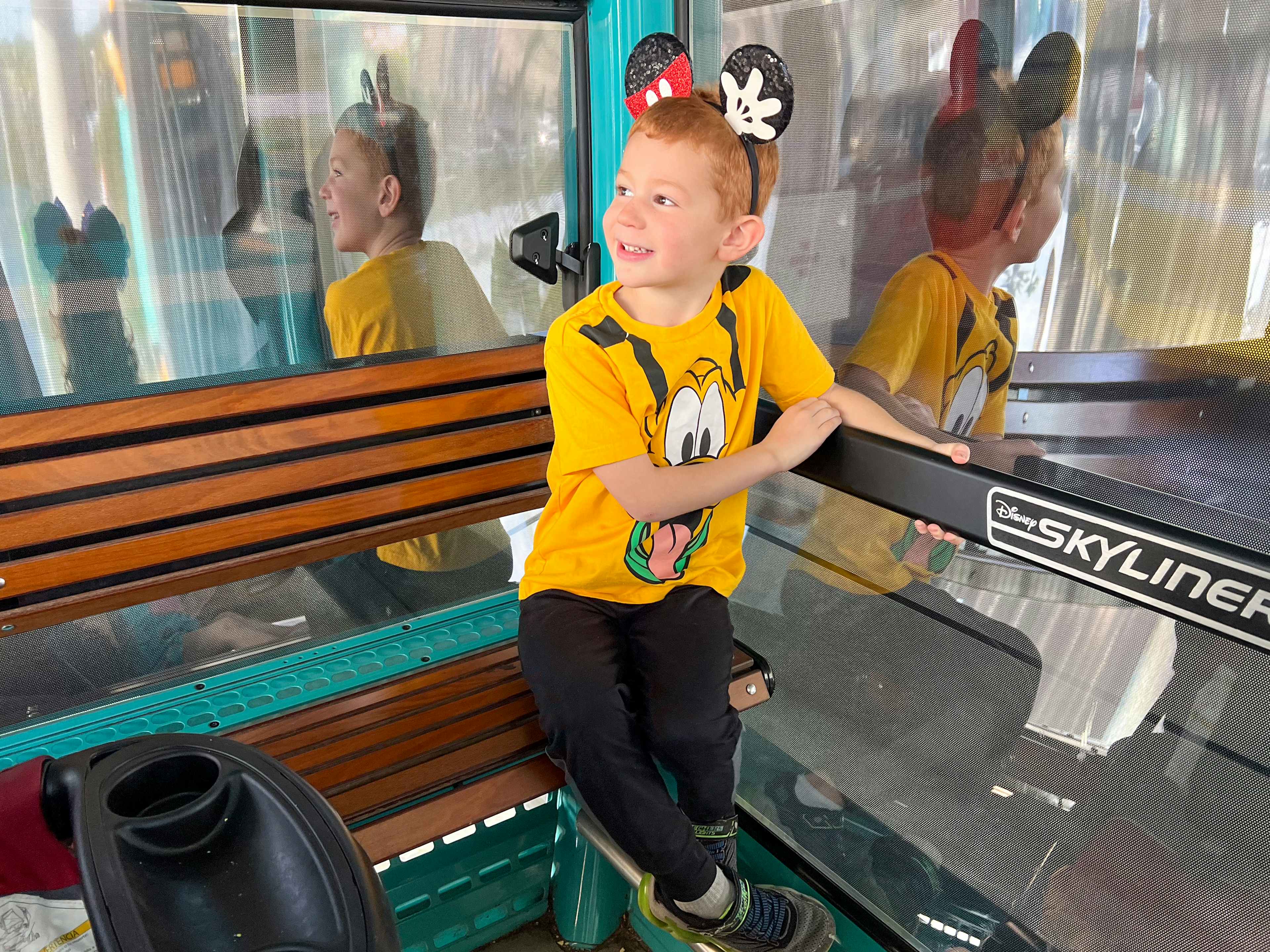a child riding the disney skyliner at disney world